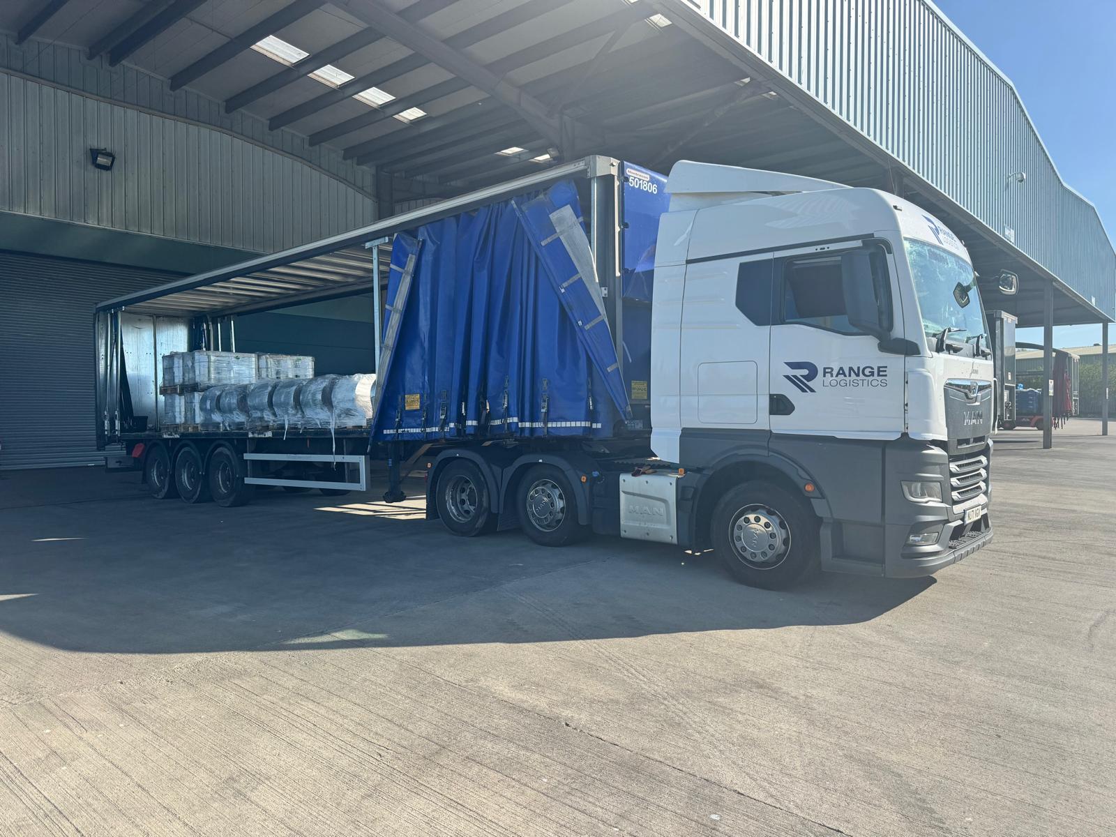 Range Logistics curtainsider being loaded at a customer depot